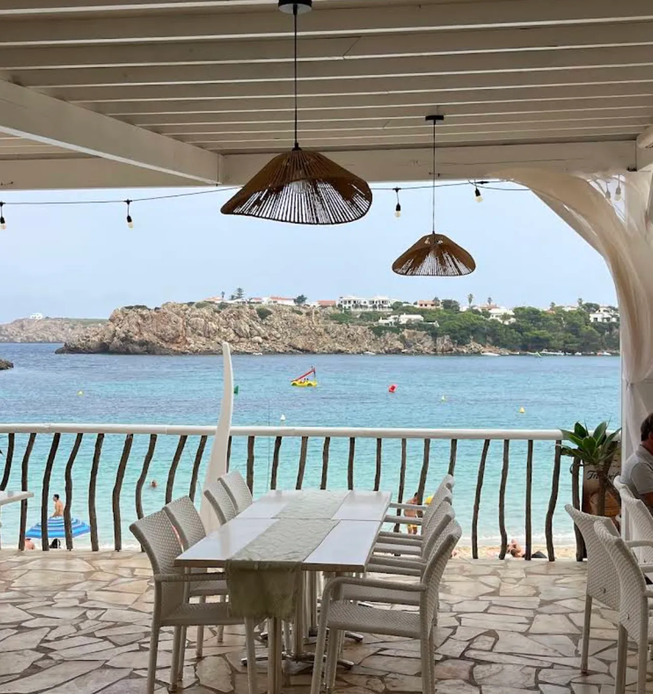 Pool area and Balinese beds at Arena Beach Menorca in Arenal d'en Castell