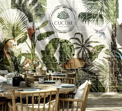 Cocktails and beachside lounge area at Cucum Beach House in Cala Ratjada