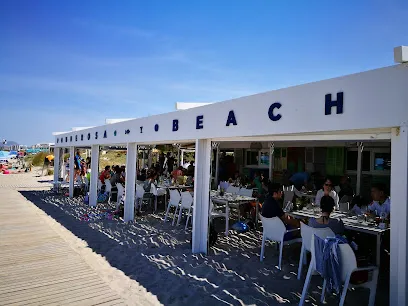 Beachfront dining and sunbeds at Ponderosa Beach on Playa de Muro