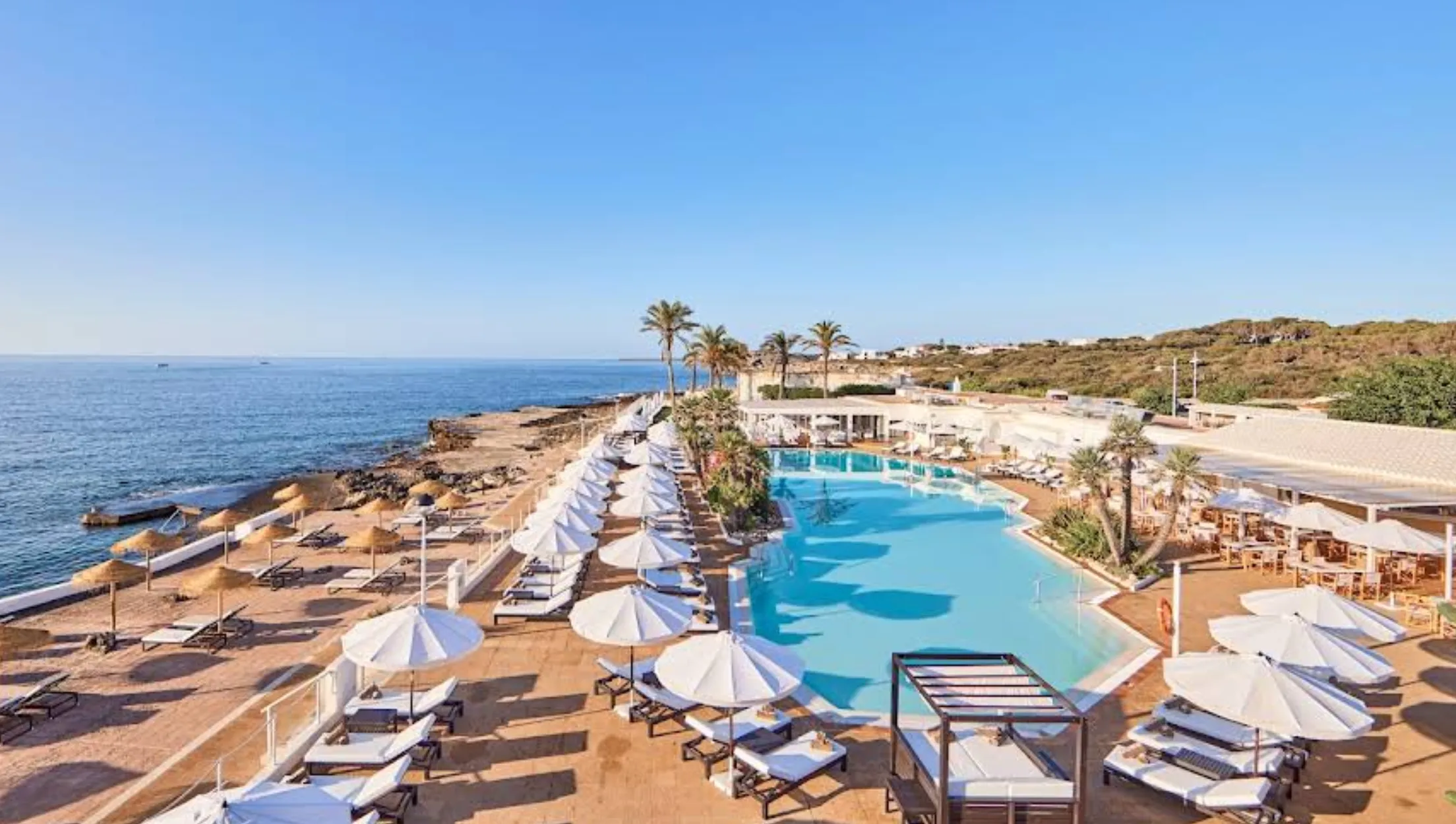 Infinity pool overlooking the Mediterranean at Purobeach Menorca in S'Algar